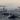 дельфины в море на фоне лодок 