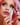 mermaid with pink hair trying on mascara