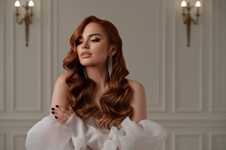 Hollywood waves created with flat iron on soft hair