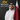 A Qatari investor in traditional attire stands in front of the Exness logo and "Legal Broker" sign, representing the broker’s legal accessibility in Qatar, compliance with international standards, and commitment to client protection.