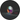 Optical lens on dark background, colored spots inside the lens
